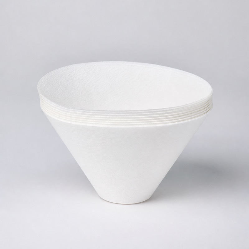 Stack of white cone-shaped paper coffee filters
