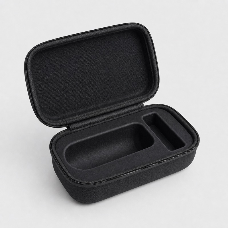 Open black hard shell case with a moulded tray shaped for a hand grinder