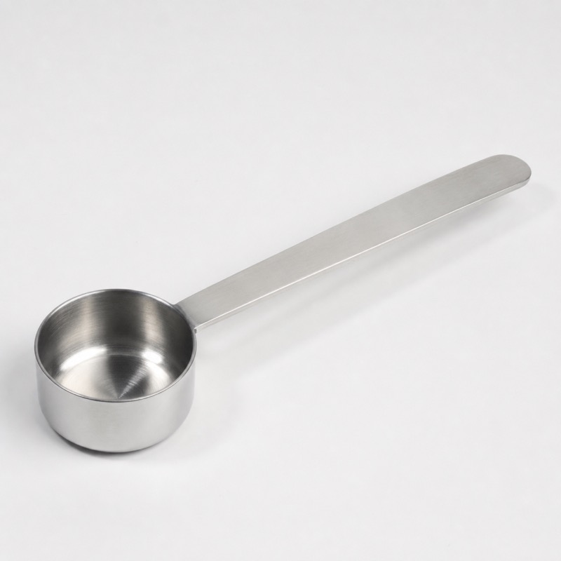 Long-handled stainless measuring spoon with a deep bowl