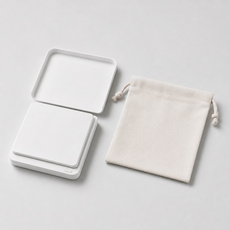 White pocket coffee scale lying flat with its lid folded back