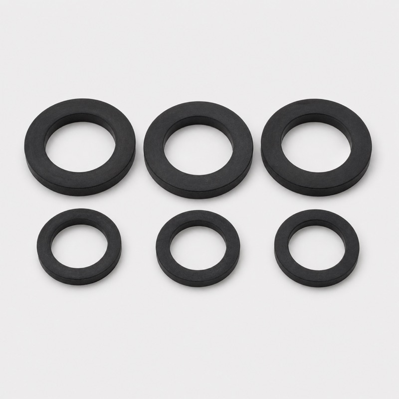 Six black rubber gasket rings arranged in two rows